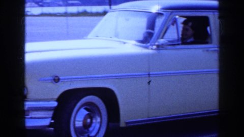 LONG ISLAND NEW YORK-1965: A Young Lady In A Vintage Yellow Thunderbird Car In The Parking Lot Footaage