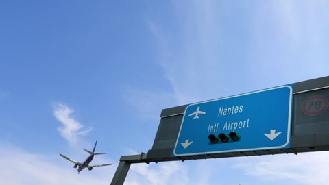 airplane flying over nantes city airport signboard france