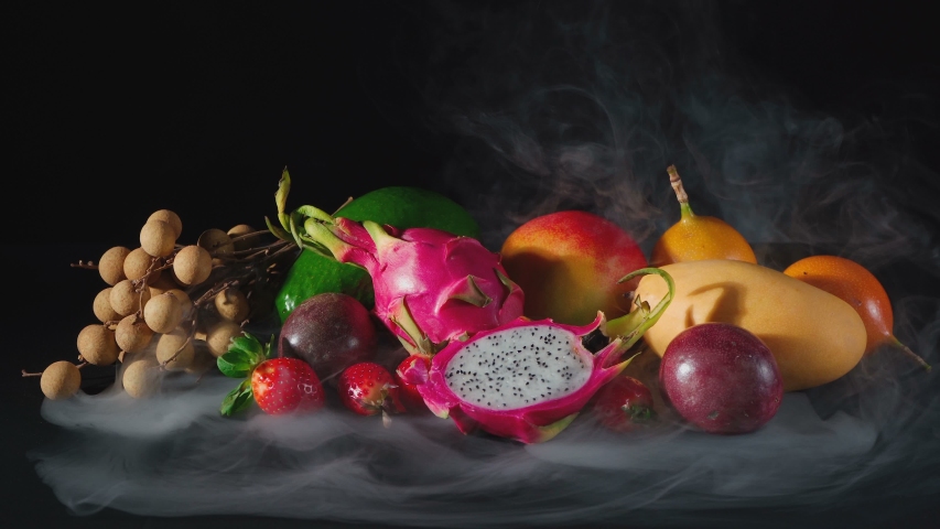 Shooting of exotic fruits in the white smoke