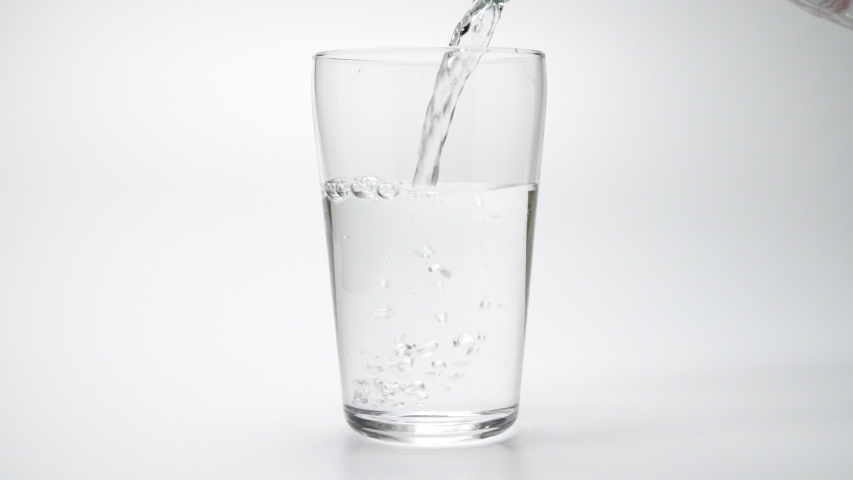 Glass of water isolated on white background | Shutterstock HD Video #1047618352