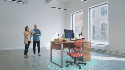 In Empty New Office: Female Interior Designer and Male Office Architect Talk, Use Augmented Reality Software on Digital Tablet Computer to Choose, Move and Manipulate 3D Furniture. VFX Render