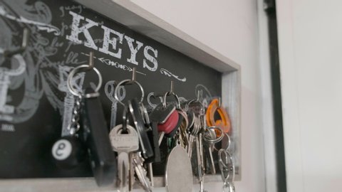 A key hanger background with many keychains at home in Bologna, Italy, 20 Feb 2020