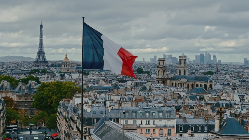 Aerial view of Paris on a moody day. From left to right is the Eiffel Tower, Les Invalides, Eglise Saint-Sulpice and in the background La Defense Royalty-Free Stock Footage #1047636850