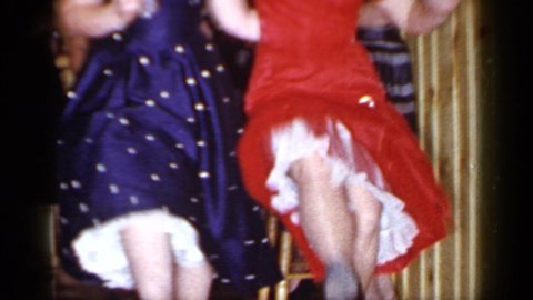 MINEOLA NEW YORK-1966: Women Dancing The Cancan In Red And Blue Polka Dot Dresses