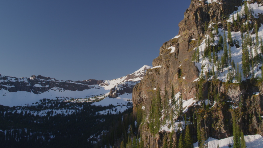 Snow-covered peaks, steep cliffs and rugged terrain in the Gallatin mountains, Montana