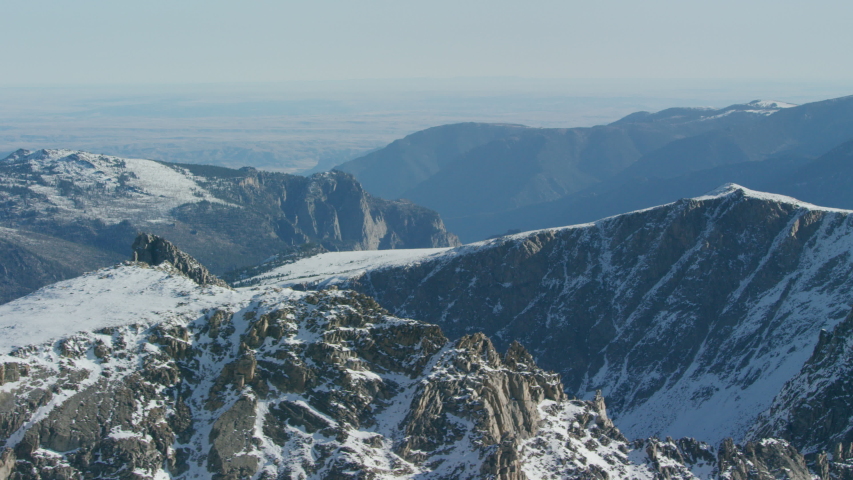 The snowcapped peaks, steep cliffs and dense forests of the Absaroka mountain Range near Yellowstone National Park