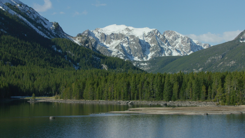 The snowcapped peaks, steep cliffs and dense forests of the Absaroka mountain Range near Yellowstone National Park