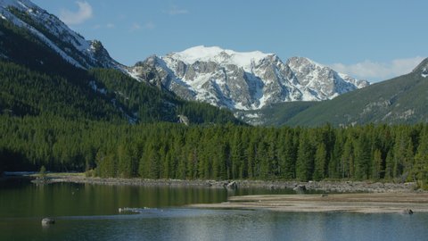 The snowcapped peaks, steep cliffs and dense forests of the Absaroka mountain Range near Yellowstone National Park