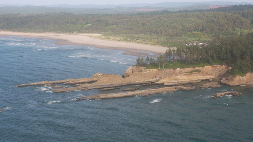 Oregon Coast circa-2019. Aerial view of rock formations at Gregory Point. Shot from helicopter with cineflex gimal and RED 8K camera.