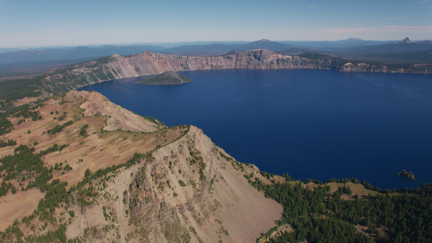 Aerial view of Crater Lake in Central Oregon, USA. Shot from helicopter with cineflex gimal and RED 8K camera.