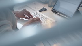 Pan Shot of Businesswoman hands typing on desktop computer keyboard for searching information, marketing research, online communication support and make a business report in the office desk at night. - Powered by Shutterstock - Get 15% off with code: PIKWIZARD15