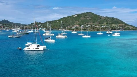 Clifton harbour, St Vincent and the Grenadines, sailboats, catamarans, island life, drone flyover