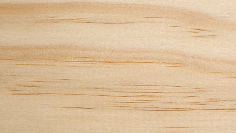 Wooden board surface tracking. Wood texture close up. Wooden background. Dolly shot, top view. 4K