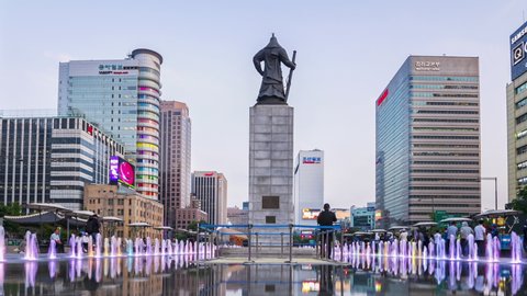 SEOUL, SOUTH KOREA - MAY 14, 2019 : Time lapse Tourists visiting Colour floor water fountain and Statue of Admiral Yi Sun-Shin at Gwanghwamun plaza in Seoul City,South Korea