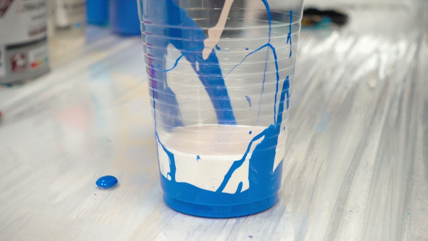 Mixing acrylic paints in workshop