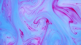 Abstract paint ink in motion. Psychedelic ebru background footage. Flowing colorful spots.