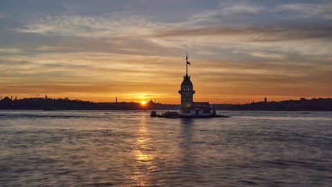 Maiden Tower / Kiz Kulesi at beautiful sunset. Sunset panorama timelapse taken at Bosphorus, in Uskudar region of Istanbul, Turkey