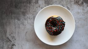 Chocolate Donut on a Plate Being Served