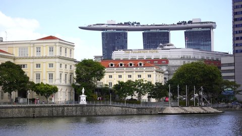 Singapore city, Singapore - february 28, 2020 : Singapore River Embankment in the city center and view of the Marina Bay Sands Hotel  
