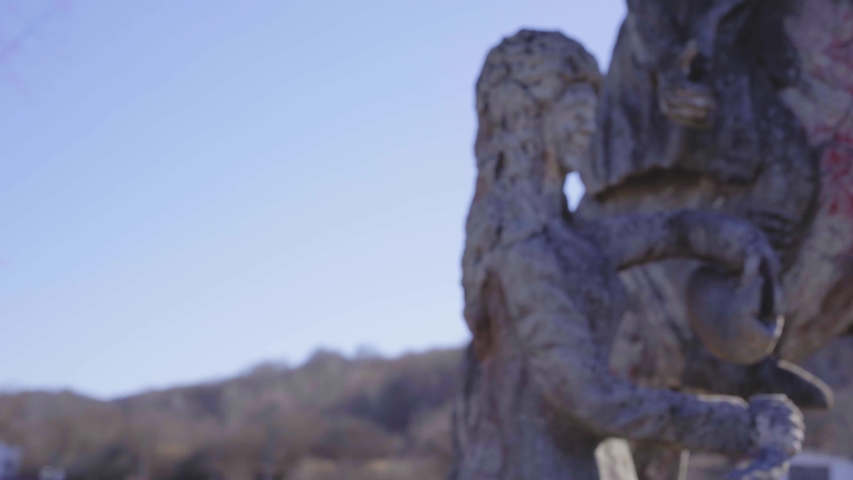 Monument of architecture. Woman with a jug