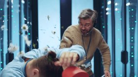 IT specialist gifting a heart-shaped box and flowers to his male colleague valentine at server room. Offended and amazed man rejecting a present fighting back with flowers kicking out. Lgbt. Everyone - Powered by Shutterstock - Get 15% off with code: PIKWIZARD15