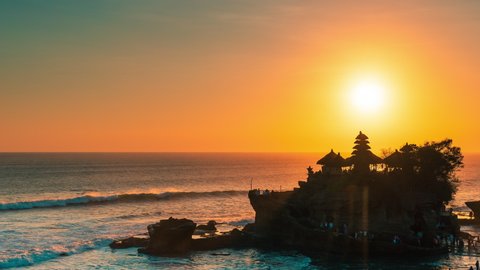 Breathtaking aerial view of of Tanah Lot Temple. Tanah Lot is a rock formation off the Indonesian island of Bali. It's home to the pilgrimage temple Pura Tanah Lot, a popular tourist and cultural icon