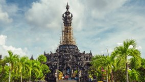 Traditional balinese hindu temple Bajra Sandhi monument in Denpasar, Temple Bali Indonesia on background tropical nature at sunrise, 4k Aerial view