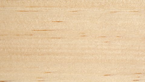 Wooden board surface tracking. Wood texture close up. Wooden background. Slider shot, top view. 4K, 422 10 bit