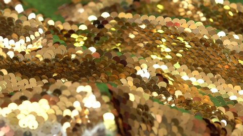 Fashion luxury fabric glitter, spangles, paillettes. Gold sequin fabric. Shiny background