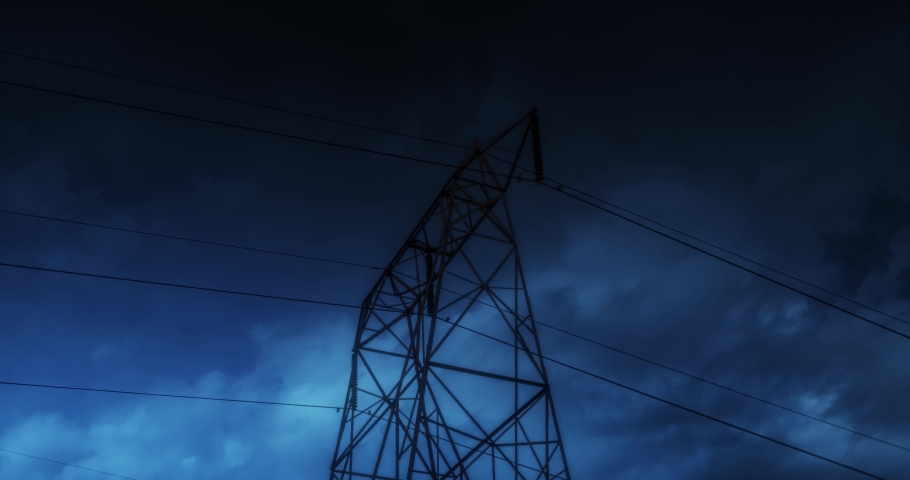 Time Lapse of Electric High Voltage Electricity Tower and lightning strikes on night dark sky in summer. beautiful thunderstorm rolling cloudscape, tornado, supercell bad, danger time. 4K loop | Shutterstock HD Video #1047824242