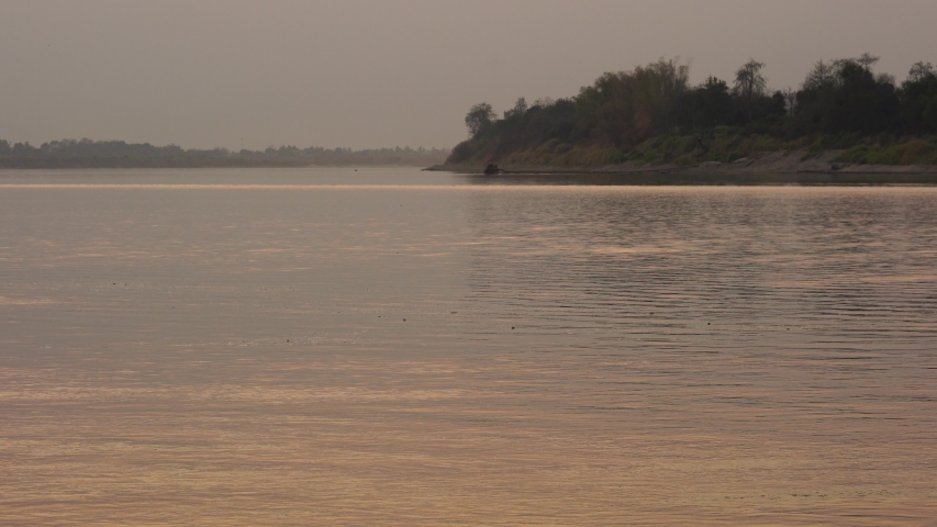The way of life of fishermen on the banks of the Mekong River with sunset.