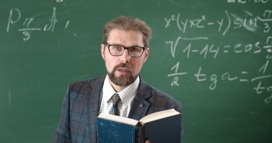 Angry bearded teacher screaming in gesticulating fiercely, unhappy with students knowledge Royalty-Free Stock Footage #1047833863