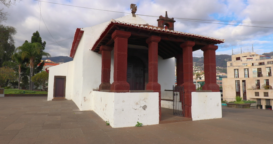 Funchal, Madeira island, Portugal. Old town architecture view. Portuguese city historic travel. Funchal small church landmark. Urban tropical Portugal cityscape. Atlantic ocean Madeira island, Europe.