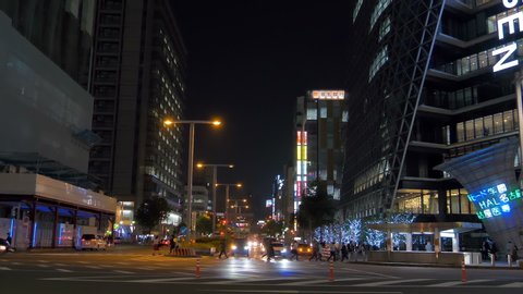Nagoya Japan 2019 November 05: View of the streets in Nagoya Japan at night time with the people crossing the streets and the buildings on the roadside