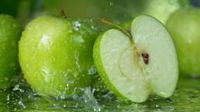 Super Slow Motion Shot of Water Splashing on Fresh Cutted Green Apple at 1000fps. - Powered by Shutterstock - Get 15% off with code: PIKWIZARD15
