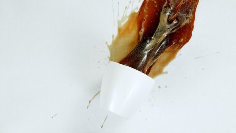 Super Slow Motion Shot of Spilling Coffee on White Cloth at 1000fps.