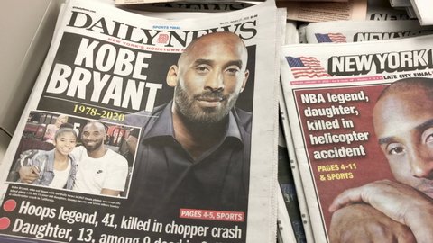 New York, New York / United States - January 27 2020: Front page of newspapers covering the death of Kobe Bryant. Pan of various publications. 