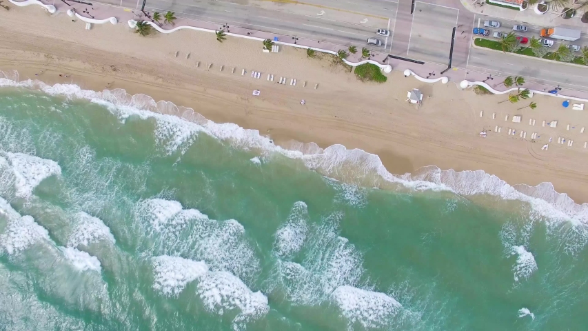 Aerial shot of Fort Lauderdale Beach with Waves Crashing