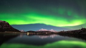 Northern lights over lake in northern Norway with reflection.	 - Powered by Shutterstock - Get 15% off with code: PIKWIZARD15