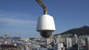 CCTV security on the building. Below is a view of the Busan city