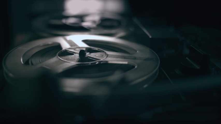 Vintage Tape Recorder Roller. Reel film tape is rotating at a vintage professional player. Oldschool concept Royalty-Free Stock Footage #1047879532