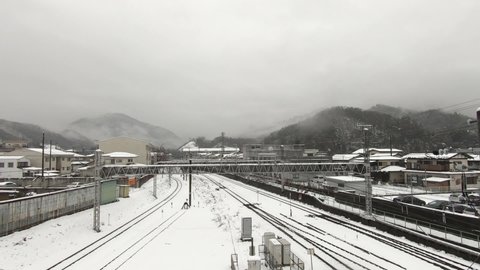 A railway running in the snow. Japanese landscape
