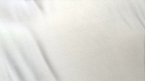 white flag cloth in full frame with selective focus. Seamlessly looping 3D animation of slight off white garment with clean natural linen texture for background banner or wallpaper use. - Powered by Shutterstock - Get 15% off with code: PIKWIZARD15