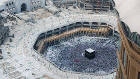 Kaaba Time lapse sunset of Muslim pilgrims circling around the holy Kaaba at day and praying inside al Masjid al Haram in Mecca, Saudi Arabia. Prores 4K