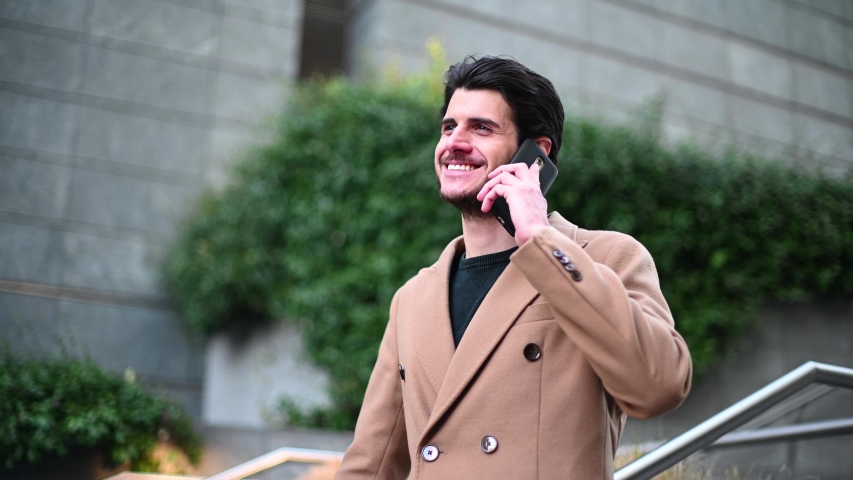 Handsome elegant dressed man talking on the phone