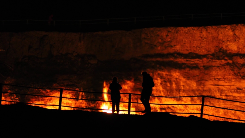 
silhouette and fire darvaza gas crater