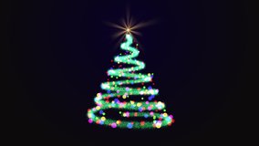 Sparkle trail Christmas tree with bright star on top decorated with colorful baubles on blue background. Green Christmas tree made by a colorful trail of glitter. - Powered by Shutterstock - Get 15% off with code: PIKWIZARD15