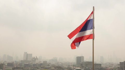 Thai national flag waving in the wind. The national flag of Thailand.