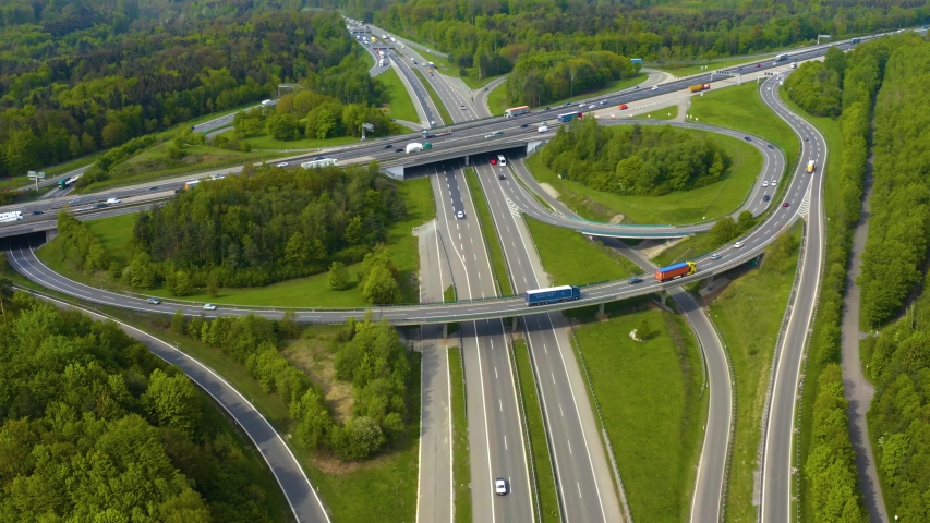 Highway, Autobahn cross road kreutz vaihingen stuttgart with pan to the right in Germany, Baden-Württemberg early morning spring. Royalty-Free Stock Footage #1047980590