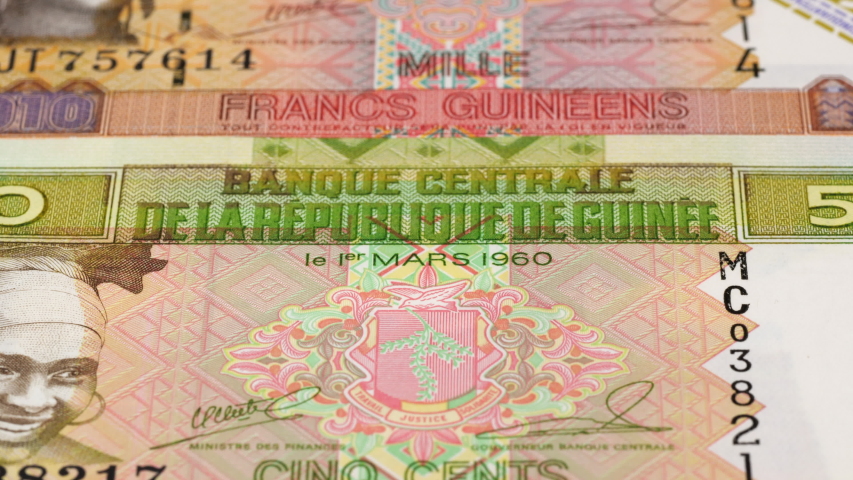 Guinea franc banknotes fast tracking. Guinean money. Slider shot, low angle. 4K, a Business & Finance Video by vkilikov